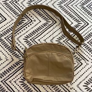 Travlon tan crossbody protection bag
